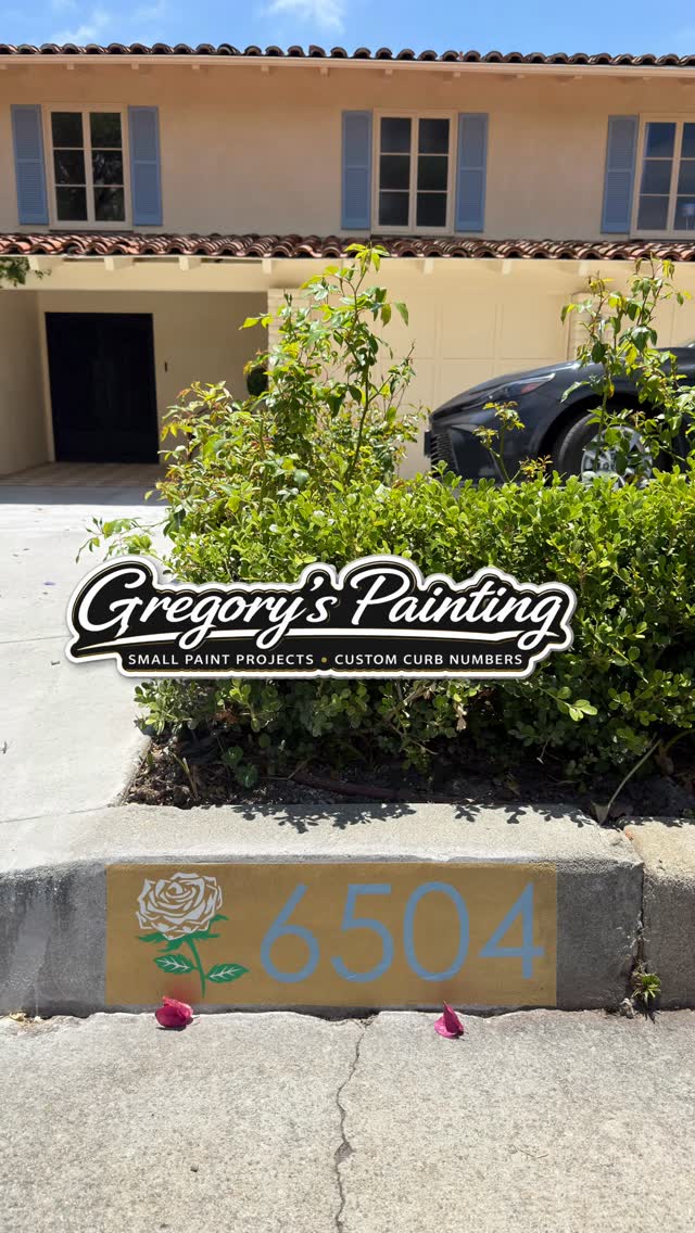 Gold curb number 6504 with a white rose
